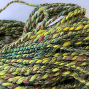 Hand spun yarn made with Shetland wool, fine merino, bio nylon and flax/linen.